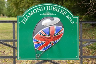 Sign for Diamond Jubilee 1952-2012 on gate entrance to public park, Netheravon, Wiltshire, England,