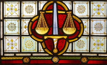 Stained glass window Bedingfield church, Suffolk, England, UK c 1878, detail of scales of justice,
