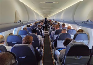Passengers in the interior of a small aeroplane, Duesseldorf, North Rhine-Westphalia, Germany,