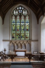 Village parish church Cratfield, Suffolk, England, UK altar and stained glass east window