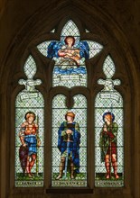 Stained glass window in Malmesbury abbey, Wiltshire, England, UK, Faith, Courage, Devotion by