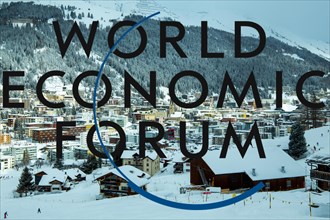 Logo of the WEF (World Economic Forum), in the background Davos from above