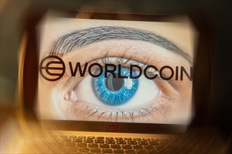 Logo of the new cryptocurrency Worldcoin on a laptop. Anyone wishing to participate in World Coin