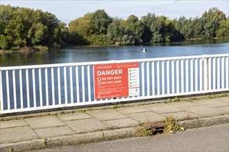 Alton Water reservoir lake, Tattingstone, Suffolk, England, UK notice warning of dangers do not