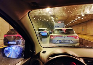 View from a car in a tunnel on the A 52 motorway with heavy traffic, Essen, Ruhr area, Germany,