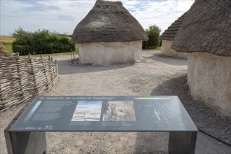 Reconstruction of neolithic homes thatched round houses huts, Stonehenge, Wiltshire, England, UK