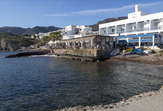 Seafront restaurant, hotel and housing at Isleta del Moro, Cabo de Gata natural park, Almeria,