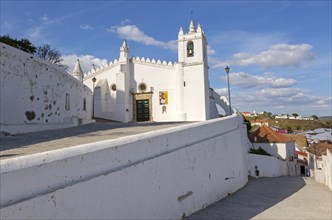 Historic whitewashed church Igreja Matrix in medieval village of Mertola, Baixo Alentejo, Portugal,