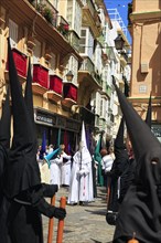 Semana Santa, procession with Nazarenos and tourists, celebrations in Cadiz, Spain, Europe