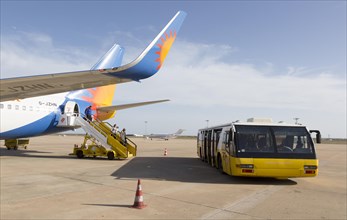 Jet2 package holiday plane passengers disembarking at the airport Faro, Algarve, Portugal with