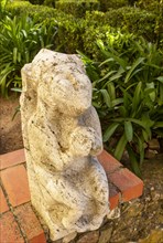 Historic stone carved stonework figure in castle garden of the Pousada Castelo de Altivo, Alvito,