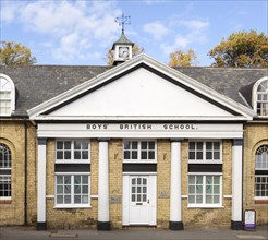 Historic building dated 1828 Boys' British School, Saffron Walden, Essex, England, UK