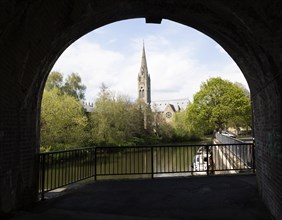 St John's RC church framed by bridge, Bath, Somerset, England, UK