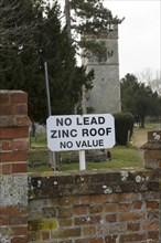 No Lead Zinc Roof No Value sign outside church to deter potential thieves who target churches for
