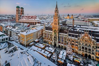 Snow-covered Marienplatz with Christmas market, Christmas market, town hall and towers of the