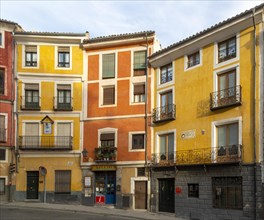 Colourful narrow historic building in a row in old part of city of Cuenca, Castille La Mancha,