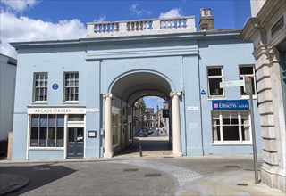 Archway entrance to Arcade Street showing the Arcade tavern pub, Ipswich, Suffolk, England, UK