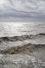 Dark storm clouds waves choppy water, North Sea, Bawdsey, Suffolk, England, UK