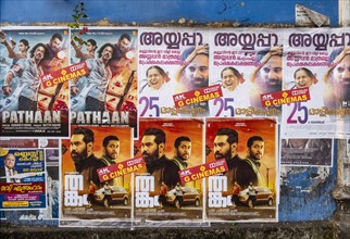 Rows of vibrant Indian Bollywood movie posters adorn a wall in Fort Kochi, Cochin, Kerala, India,