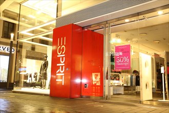 Shop window of the Esprit shop in Mannheim with advertising for big discounts