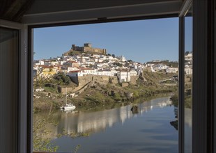 Historic hilltop walled medieval village of Mertola with castle, on the banks of the river Rio