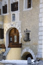 Entrance door, window, sgraffito, facade decorations, historic houses, Guarda, Engadin, Grisons,