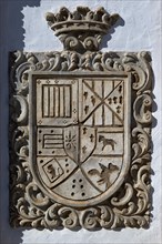 Stone heraldic family Coat of Arms on wall of building, Frigiliana, Axarquia, Andalusia, Spain,
