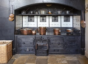 Cooking range inside the Victorian kitchen at Audley End House, Saffron Walden, Essex, England, UK