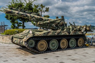 Side view of 8 inch self-propelled gun on display at seaside park in Seosan, South Korea, Asia
