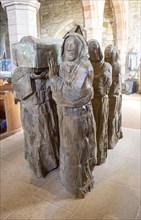 The Journey Sculpture of monks carrying body of Saint Cuthbert by Fenwick Lawson 1999 Holy Island,