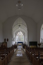 Interior village parish church of Saint Peter, Westleton, Suffolk, England, UK chancel arch and