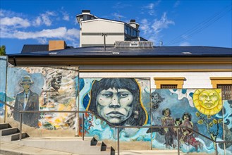Street art wall with images of the indigenous Yaghan people, Ushuaia, Tierra del Fuego Island,