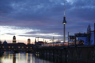 City view Berlin in the evening. View across the Spree to the television tower and the red town