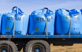 Bags of blue Nitram nitrogen fertiliser on back of lorry trailer, Suffolk, England, UK