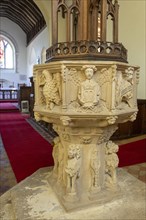Church of Saint Mary, Newbourne, Suffolk, England, UK. carved figures stone baptismal font