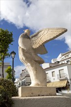 Artwork sculpture of hand holding dove of peace, Mijas pueblo, Malaga province, Andalusia, Spain,