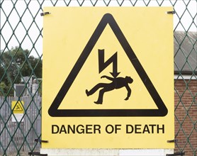 Close up sign Danger of Death at electricity sub station, Knodishall, Suffolk, England, UK