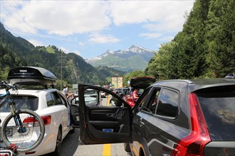 After an accident in the Gotthard tunnel in Switzerland, a long traffic jam forms in front of it