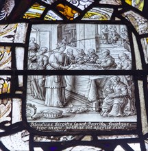 Stained glass window in All Saints church, Eyke, Suffolk, England, UK, Saint Bridget feeding the