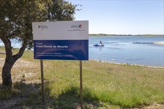 Sign for freshwater beach on reservoir lake at Mourao, Alentejo Central, Evora district, Portugal,