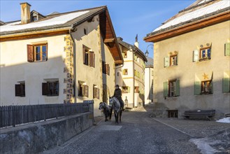 Horsewoman on horseback, historic houses, sgraffito, facade decorations, historic village, Guarda,