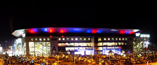Night shot of the brightly lit SAP Arena in Mannheim at an Adler Mannheim home game