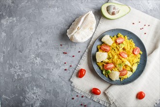 Fried pomelo with tomatoes and avocado on gray concrete background. Top view, copy space, myanmar