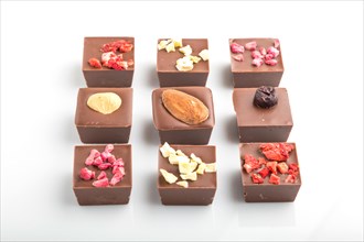 A pieces of homemade chocolate isolated on white background. side view, close up