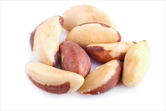 Pile of Brazil nuts isolated on white background. close up