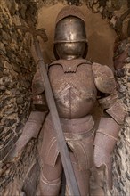 Rusty knight's armour with lance in a niche in the outer bailey, Ronneburg Castle, medieval