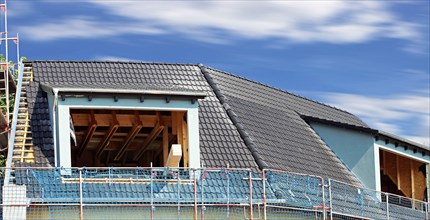 Panoramic image of the roof covering of a new tiled roof on a residential building