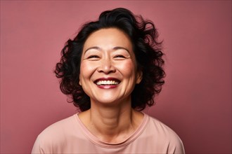Happy mature Asian woman with dark hair on studio background. KI generiert, generiert AI generated