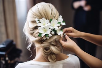 Hairdresser styling bridal hair with flowers. KI generiert, generiert AI generated