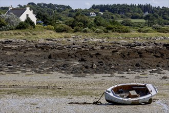 Small boat on the beach at low tide, Brittany, France, Europe